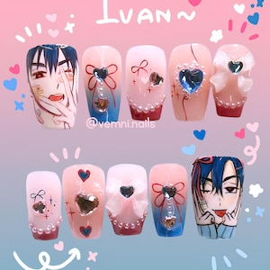 May include: A set of ten custom-designed artificial nails. The nails feature anime-style character art, heart-shaped gems, bows, and pearl accents. The color palette includes pink, blue, and white, with the name "Ivan" written at the top.