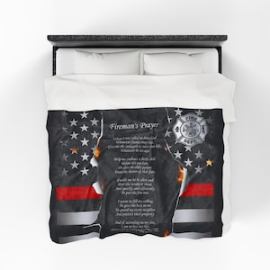 May include: A white and black comforter featuring an American flag design with a red stripe and the text "Fireman's Prayer." The comforter also includes a fire department emblem and a poem.
