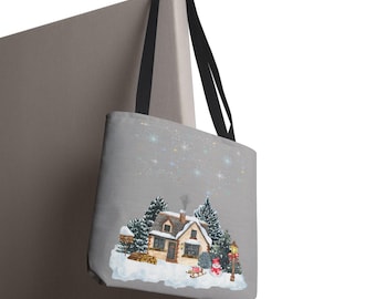 May include: A grey tote bag with black handles featuring a printed illustration of a snow-covered cottage at night. The scene includes evergreen trees, a small snowman, a wooden sled, a lamp post, and a starry sky above the house.
