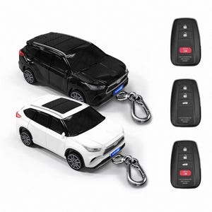 May include: A set of three ceramic mugs with a speckled, matte finish. The mugs are in shades of cream, light grey, and dark grey. Each mug has a simple, minimalist design and a rounded handle. Ideal for tea or coffee.