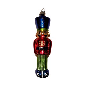May include: A Christmas ornament shaped like a toy soldier. The ornament has a blue hat, a red jacket, green pants, and black boots. The ornament is made of glass and has a metallic finish.