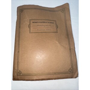 May include: A vintage, tan-colored notebook with the text "UNIVERSITY OF CALIFORNIA AT LOS ANGELES" at the top. The notebook has a rectangular label with the handwritten text "Botany 101" and "Milarcik, Fiona". The notebook has a decorative border.