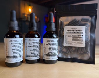 May include: Three amber glass bottles with black droppers and labels, and a black pouch of capsules. The bottles are labelled "Pre-Para-X", "Para-Dida", and "Para-Nada", with ingredient lists. The pouch is labelled "Para-Dida Binder".