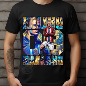 May include: Black t-shirt featuring a stylized illustration of a soccer player in a red, white, and blue uniform. The design includes the player's name and number in gold and blue, with the word "ORIGINAL" at the bottom.