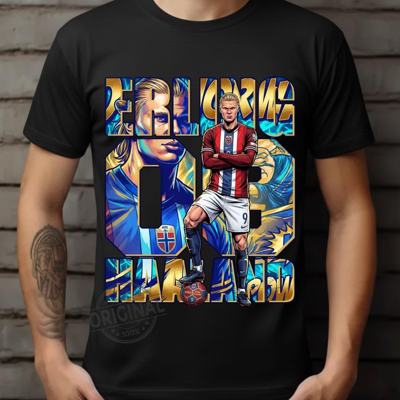 May include: Black t-shirt featuring a stylized illustration of a soccer player in a red, white, and blue uniform. The design includes the player's name and number in gold and blue, with the word "ORIGINAL" at the bottom.