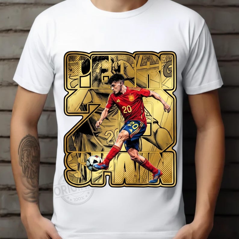 May include: White t-shirt featuring a graphic of a soccer player in a red and blue uniform kicking a soccer ball. The graphic includes the text "PEREZ SPAN" in a gold, outlined font.