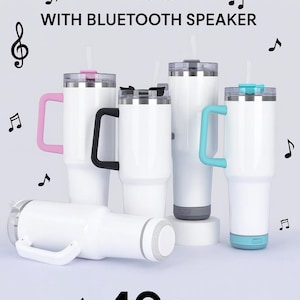 May include: White travel sublimation mugs with Bluetooth speakers, featuring colored handles and accents. The image shows several 40oz mugs with pink, black, and teal details, along with musical note graphics.
