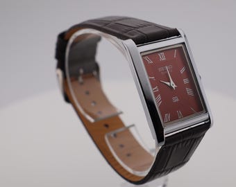 Vintage Seiko Quartz Watch: Red Dial, Stainless Steel, Leather Strap