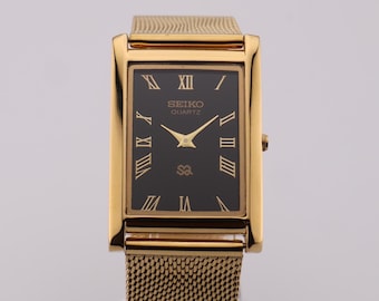 Vintage Seiko Slim Tank Watch: Black Dial, Gold Case, Stainless Steel Bracelet