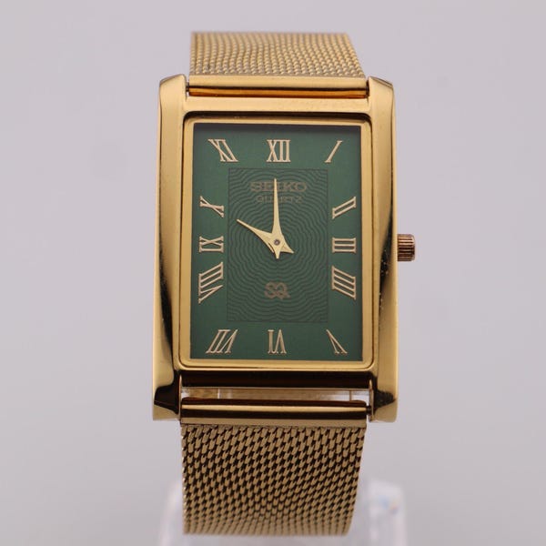 Gekleed uurwerk met ziel Vintage Seiko slank quartz herenpolshorloge groene wijzerplaat - gouden kast