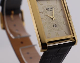 Vintage Seiko Quartz Watch: Gold Dial, Leather Strap, Slim Tank