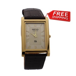 Vintage Seiko Quartz Watch: Gold Dial, Leather Strap, Slim Tank