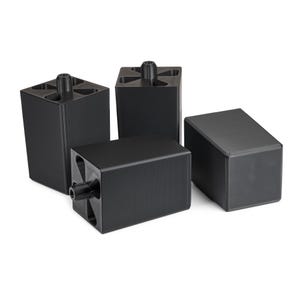 May include: Four black square furniture risers with a rounded top and a small plastic knob on the top.