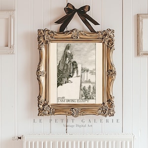 May include: A vintage black and white illustration of a woman in a long robe standing on a balcony overlooking a city. The text "I AM DYING EGYPT" is printed below the image.