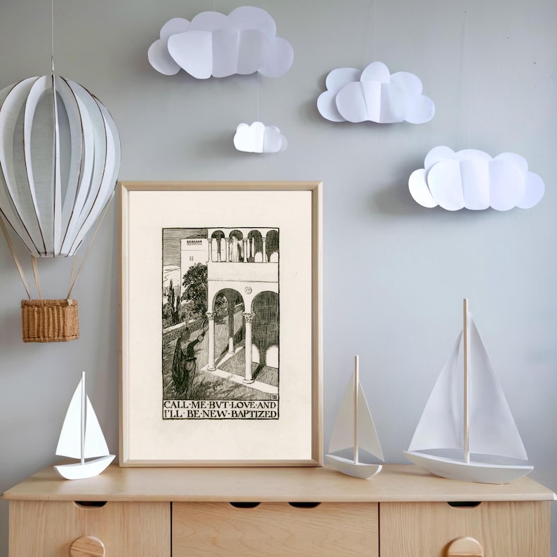 May include: Black and white print of an architectural scene with the text "CALL ME BUT LOVE AND I'LL BE NEW-BAPTIZED". The print is framed and hanging on a wall with white paper clouds hanging from the ceiling.