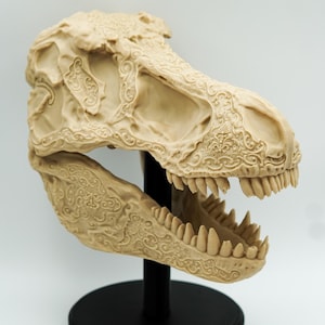 Intricately Carved Tyrannosaurus Rex Skull – Artisan Fossil Replica with Floral and Ornamental Detailing