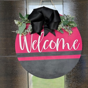 Magenta Welcome Door Hanger: Black Bow & Faux Greenery, Round Wood Sign