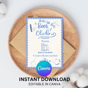 May include: A book club invitation with blue text and a scalloped border. The invitation includes the text "Join us for Book Club" and "Book of the Month: A Court of Thorns and Roses." The invitation is on a wooden tray with a brown envelope.
