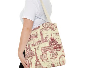 May include: A beige tote bag featuring a repeating dark red line-art pattern of various European landmarks, including the Eiffel Tower, the Arc de Triomphe, and the Sacré-Cœur, with the word Postcard printed in a cursive script font.