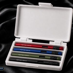 May include: A white rectangular plastic storage case containing four cylindrical pens in red, blue, olive green, and black. Each pen features the text PEPTIDE PEN V2 printed in white, a small rectangular window, and a black dial at the end.