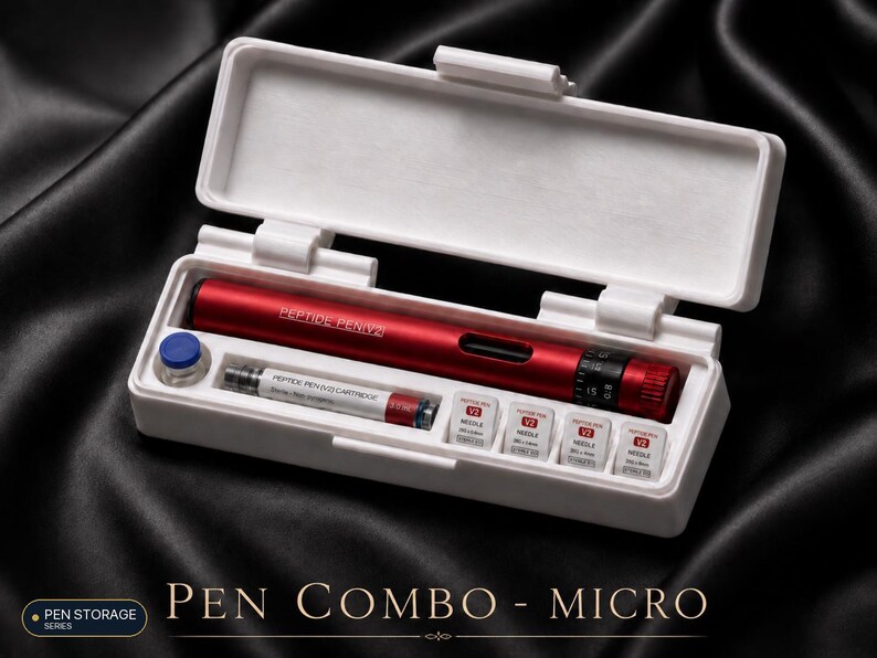 May include: A red Peptide Pen V2 device housed in a white rectangular storage case. The set includes a Peptide Pen V2 cartridge, a small blue cap, and four individual needle attachments labelled V2 Needle, all organised in custom-fitted slots.