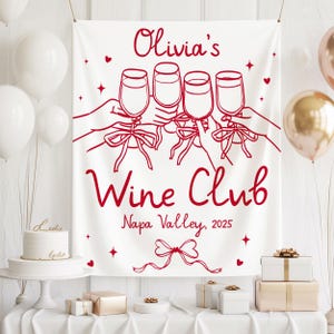 May include: A white banner with red text and illustrations. The banner reads "Olivia's Wine Club, Napa Valley, 2025" and features a drawing of four hands toasting wine glasses. The banner is decorated with hearts and stars.
