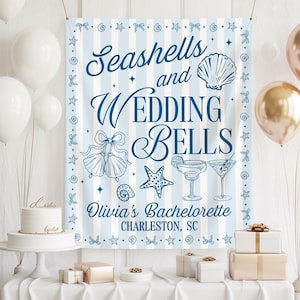 May include: A blue and white striped banner with navy blue text reading "Seashells and Wedding Bells". The design features illustrations of seashells, starfish, and cocktails, with "Olivia's Bachelorette" and "Charleston, SC" below.