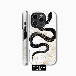 May include: A white phone case featuring a black snake design with gold glitter accents. The snake is winding around a floral pattern with stars. The case has a cutout for the phone's camera.
