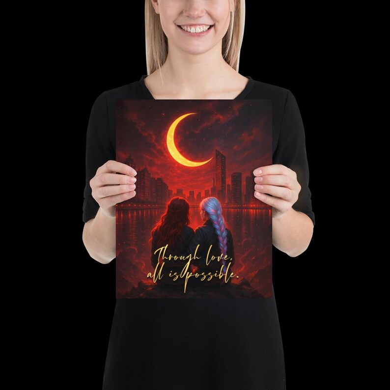 May include: A square art print featuring two figures with long hair, facing away from the viewer, with a cityscape and a crescent moon in a red sky. The text "Through love, all is possible" is written in gold.