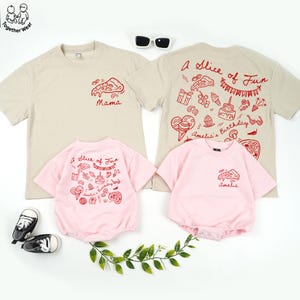 May include: A family matching set of t-shirts and onesies. The beige t-shirts have a red pizza slice graphic and the word "Mama". The pink onesies have the text "A Slice of Fun" and a pizza slice graphic. The back of the beige t-shirt has the text "A Slice of Fun".