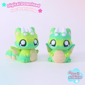 May include: Two small, green and yellow dragon figurines with large black eyes, white horns, and beige bellies. The text Digital Download For 3D Printing appears at the top, and the text Quail Studio3D appears in a blue cloud at the bottom right.