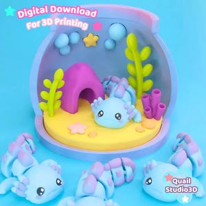 May include: A 3D printed diorama featuring a light blue axolotl inside a bowl-shaped enclosure with a yellow base, purple cave, green seaweed, and pink coral. The text reads Digital Download For 3D Printing and Quail Studio3D.