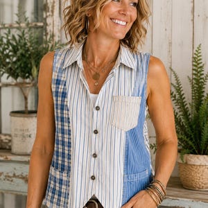 May include: A sleeveless button-down vest featuring a patchwork design of blue and white plaid, vertical blue and white stripes, and solid blue denim panels. The vest includes a pointed collar, a single chest pocket, and a V-shaped hemline.