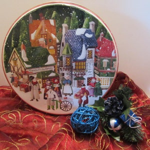 Streets of Dickens Village Christmas Tin - Department 56 - Christmas Street Scene - Carolers - Vendors - Shops
