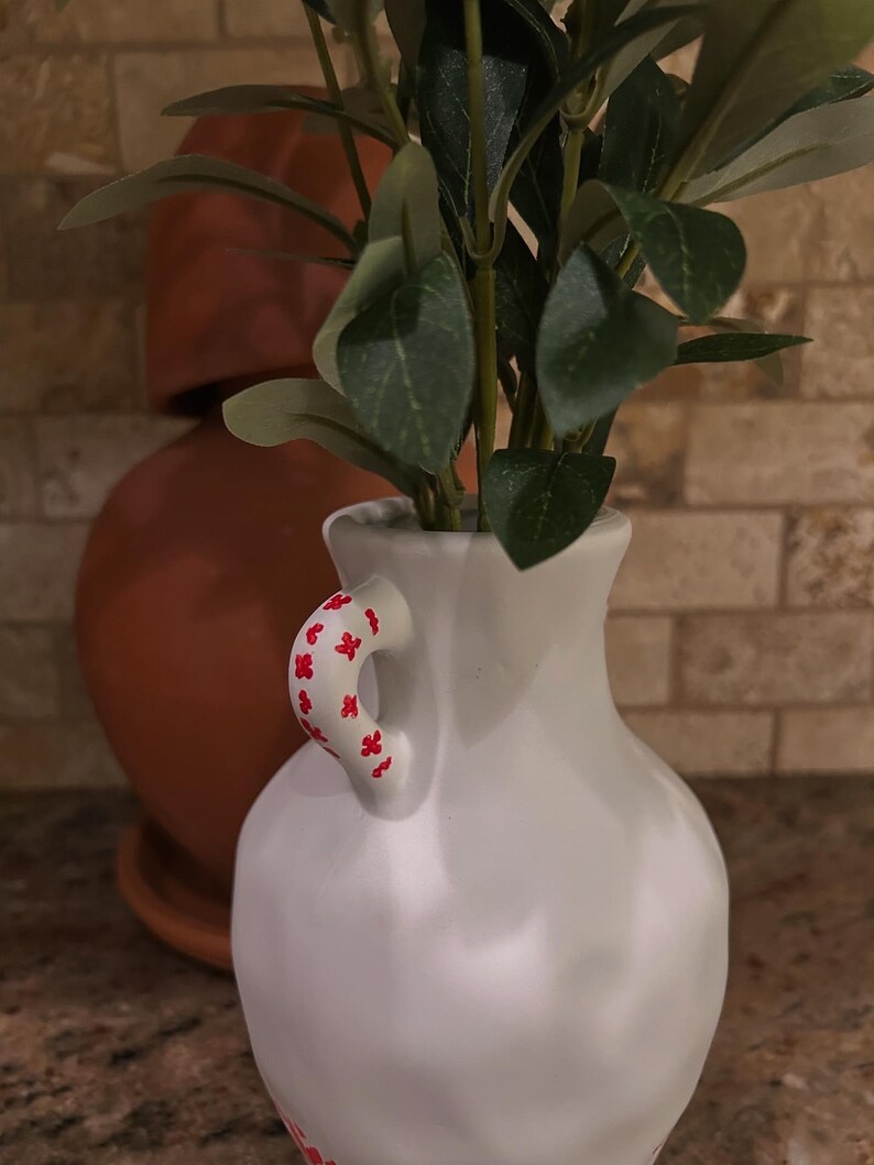 Hand painted 7”x4” ceramic vase with faux olive tree branch. White vase with tatreez Palestinian design. Palestine inspired decor.