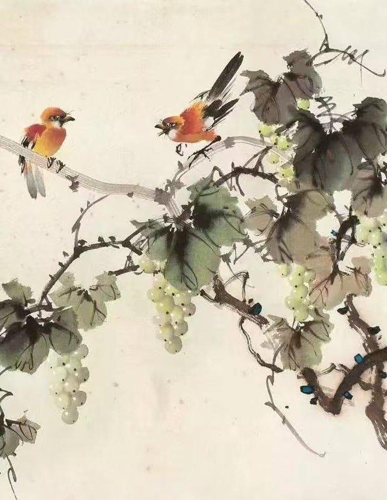 May include: A traditional Chinese ink and wash painting depicting two birds perched on a grapevine with clusters of white grapes. The birds are painted in shades of orange and red, while the vine is rendered in black ink with delicate brushstrokes.