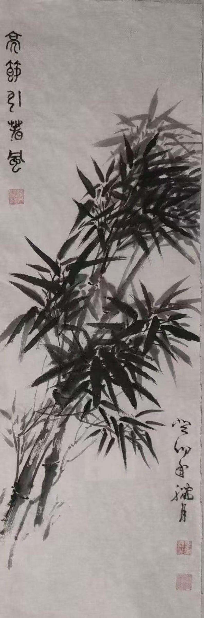 May include: Black and white ink painting of bamboo stalks and leaves on a white background. The painting is signed in Chinese characters in the lower right corner.