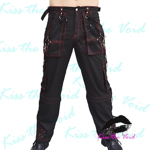 May include: Black cargo pants with red stitching and multiple pockets and straps.