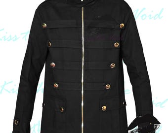 May include: A black zip-up jacket with gold buttons and multiple pockets. The jacket has a stand-up collar and long sleeves.