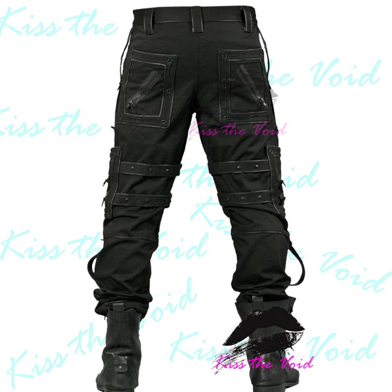 May include: Black cargo pants with multiple pockets, straps, and zippers. The pants have a unique design with reinforced stitching and metal accents. The pants are paired with black boots. The text "Kiss the Void" is visible in the background.