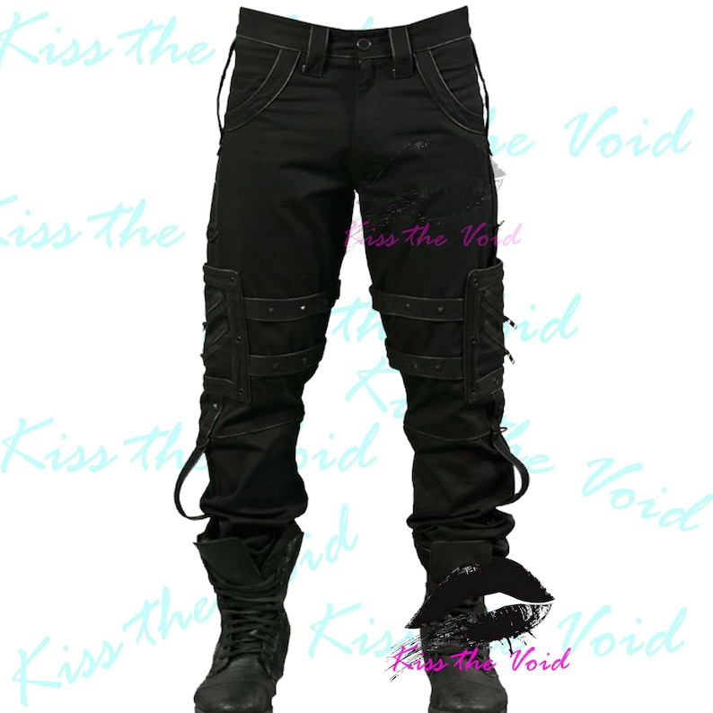 May include: Black cargo pants with multiple pockets, straps, and rivets. The pants have a distressed look and are paired with black boots. The text "Kiss the Void" is visible in the background.