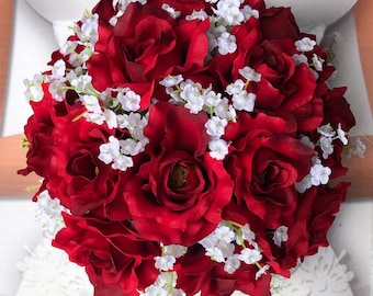 red rose bridal bouquet with diamond head pins,white ribbon and babies  breath.