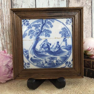 Antique Delft Blue Tile 17th century RARE. Hand painted blue and white. Man, Maiden by a lake, clarinet serenade, snails. Framed Delftware.