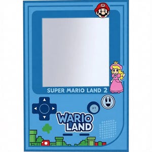 May include: A blue mirror shaped like a retro handheld game console, featuring Mario and Princess Peach characters. The mirror has the text "SUPER MARIO LAND 2" and "WARIO LAND" on it. The design includes a D-pad, buttons, and pixelated graphics.