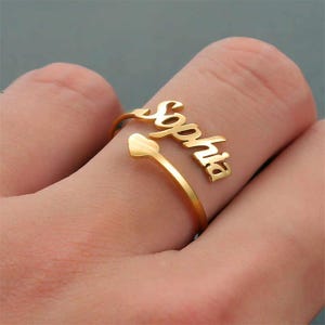 Anel com nome e coração personalizados • Anel ajustável personalizado • Presente para ela • Anel de compromisso de coração • Anel com nome em aço inoxidável e ouro