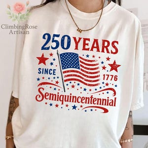 May include: Cream-colored t-shirt with a patriotic design. The graphic features the text "250 YEARS SINCE 1776 Semiquincentennial" in red and blue, along with an American flag and stars.