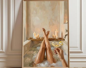 May include: A framed art print depicts a relaxing scene of legs crossed in a bathtub filled with bubbles. A hand holds a cocktail with a lemon twist. Candles and a wooden tray add to the spa-like ambiance. The artwork is displayed against a neutral wall.