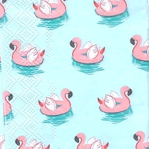 May include: A light blue background with a repeating pattern of pink flamingo pool floats. The flamingo floats have white wings and are in a turquoise pool.