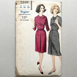 May include: Vintage Vogue printed pattern envelope featuring illustrations of two dresses. The envelope is off-white with text and illustrations in black, red, and gray. The pattern number is 5134, with bust and hip sizes listed. The price is 75¢.