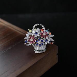 May include: A set of three ceramic mugs with a speckled, matte finish. The mugs are in shades of cream, light gray, and dark gray. Each mug has a simple, minimalist design, perfect for coffee or tea.